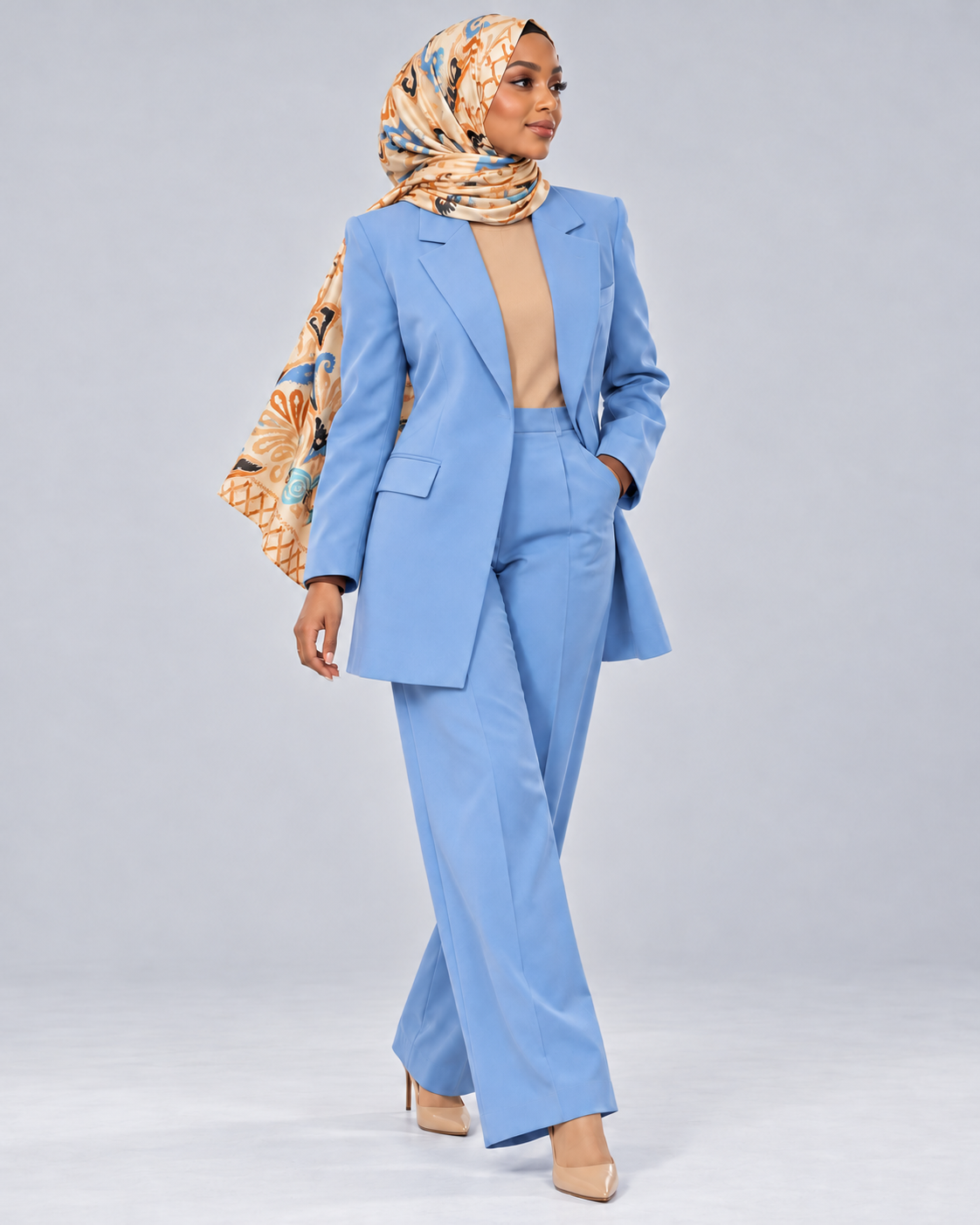 Woman wearing the tan and blue floral hijab